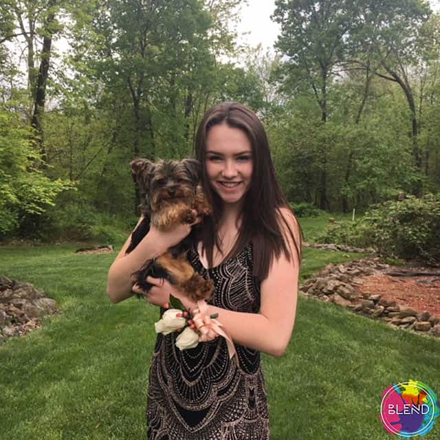 A young lady with a dog explains how to manage stress.