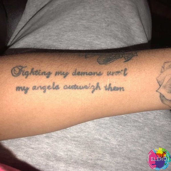 A young lady with a tattoo on her arm explains how her therapist helped her overcome depression.