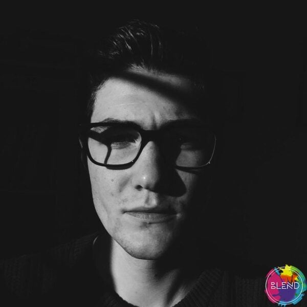 A dark haired man with glasses shares his story on how he overcomes self-harm and depression.